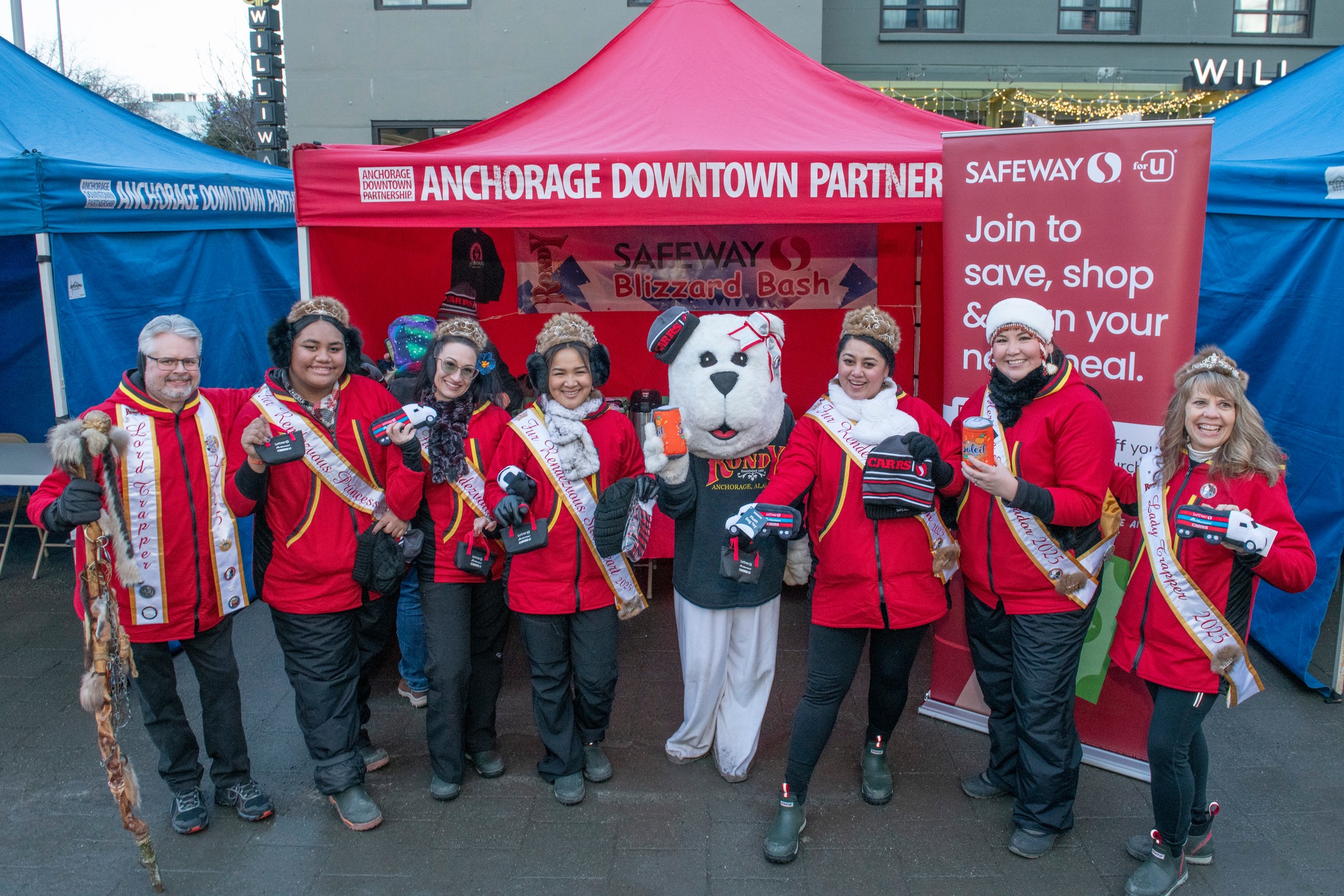 The 2025 Fur Rondy Royalty stand with Safeway and the Anchorage Downtown Partnership during the Blizzard Bash.